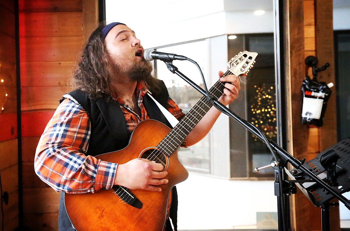 Colton Christensen, of Kalispell, performs a set at Bias Brewing on Friday evening, March 13. (Mackenzie Reiss/Daily Inter Lake)