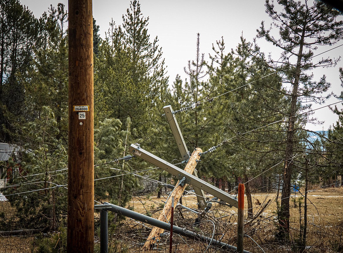 A downed power line is pictured on Montana 83 last Saturday, following a wind storm that left thousands without power. 
  
 Courtesy Kristy Pancoast