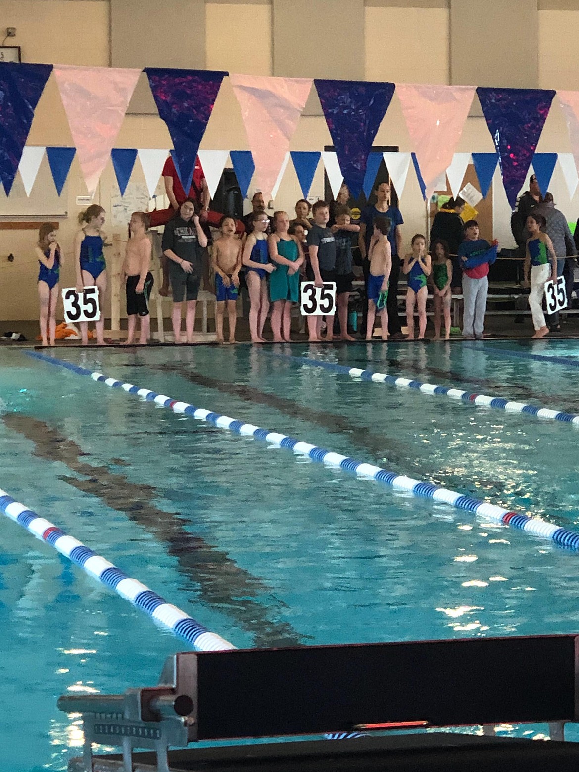 The Lake Monster's Swim Team cheering on their mile racers. (Photo provided by coach Shayna Swanson)