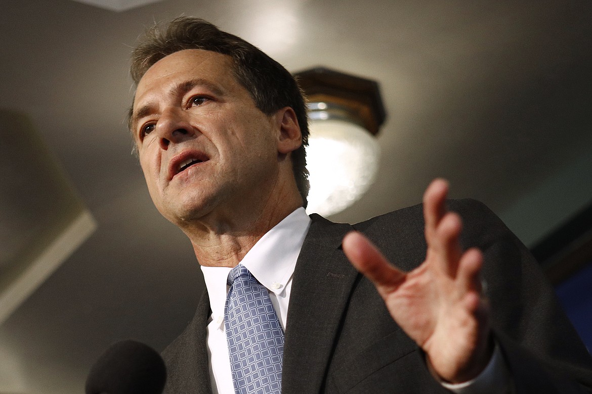 FILE - In this Aug. 7, 2019, file photo, Montana Gov. Steve Bullock speaks at the National Press Club in Washington. Bullock's office warned Friday, March 20, 2020, that Montana could face extended closures of public gathering places in the push to slow the spread of the coronavirus. (AP Photo/Patrick Semansky, File)