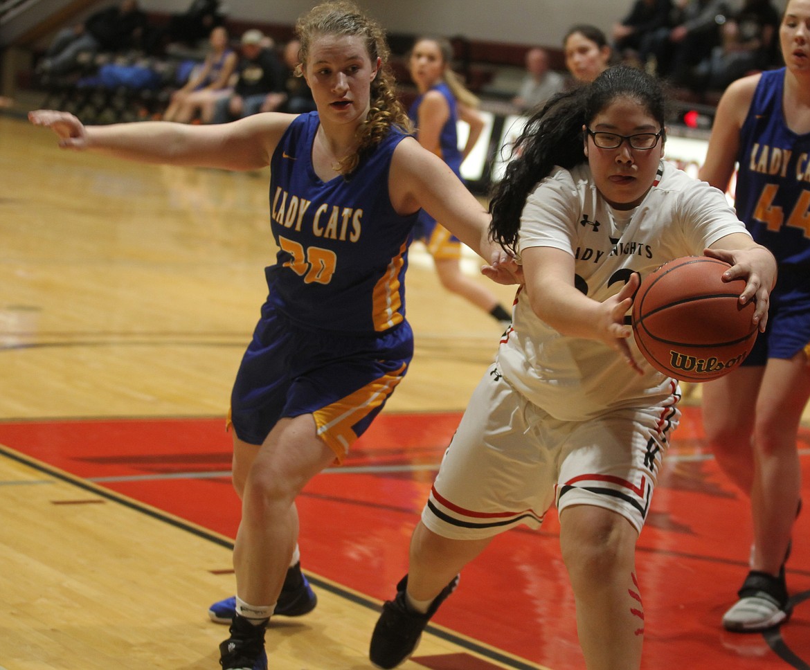 Lakeside freshman Kiona Allen pulls down a rebound during the 1A Division II District 1 girls basketball championship game on Feb. 13 at North Idaho College.