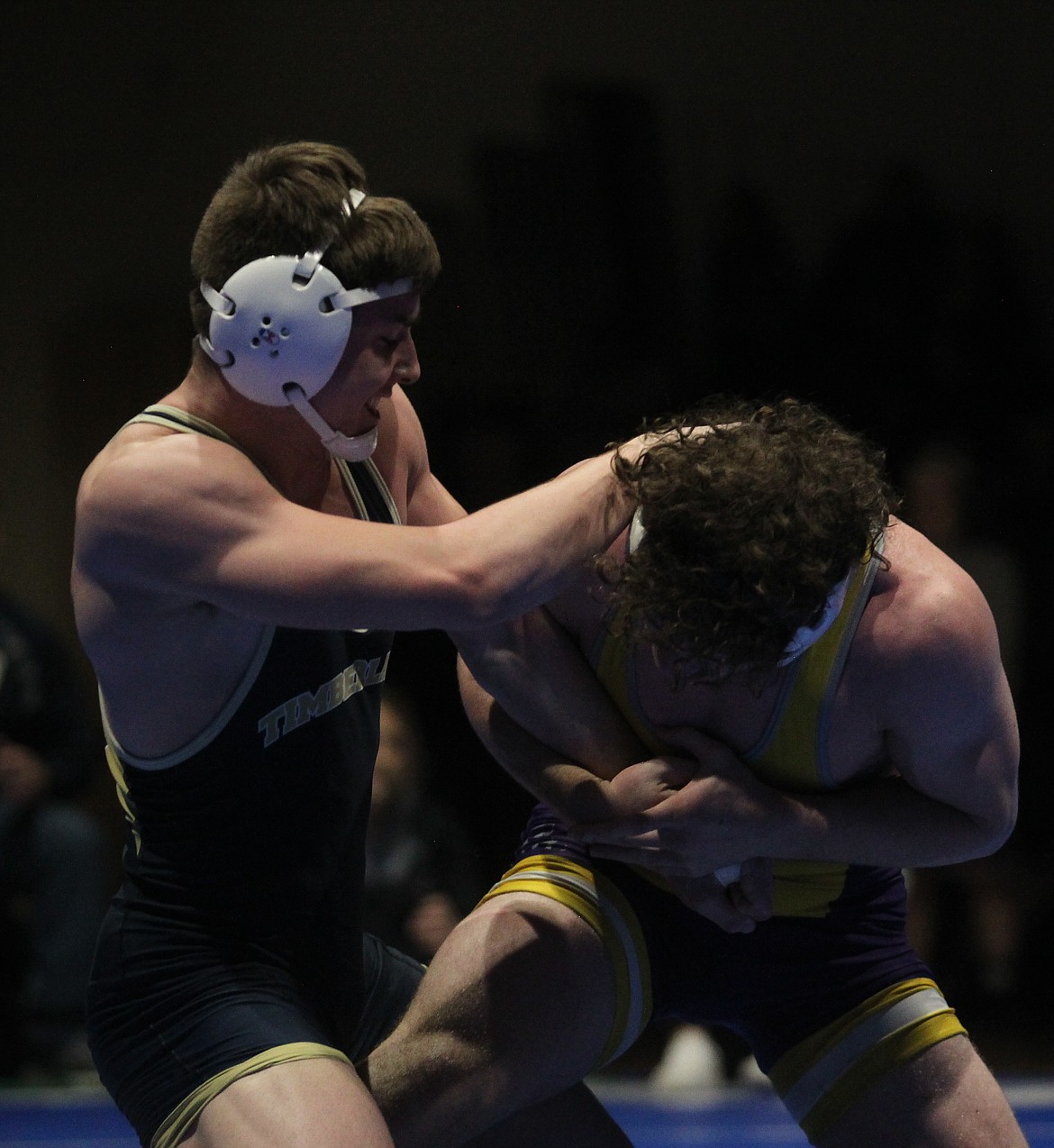 Timberlake senior Joey Follini pushes off Lewiston’s Reuben Thill in the 182-pound championship match at the North Idaho Rumble at Coeur d’Alene High in January.