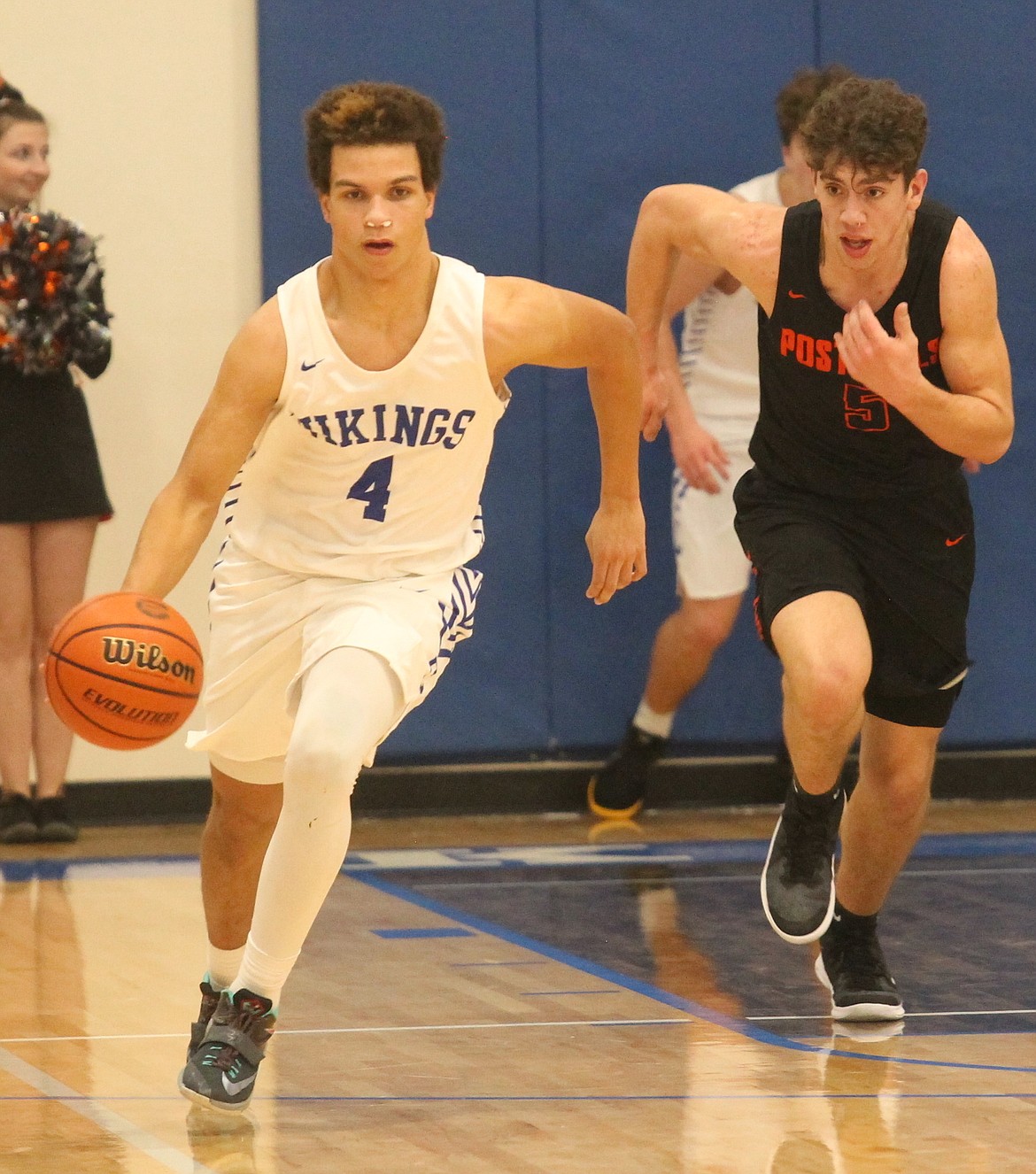 Devon Johnson of Coeur d’Alene dribbles up the floor as Zack Rodriguez of Post Falls pursues in a game earlier this season at Viking Court.