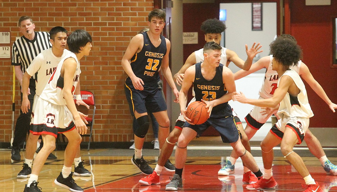 Seth Neely of Genesis Prep is surrounded by Lakeside players in the 1A Division II District 1 championship game Feb. 27 at North Idaho College.