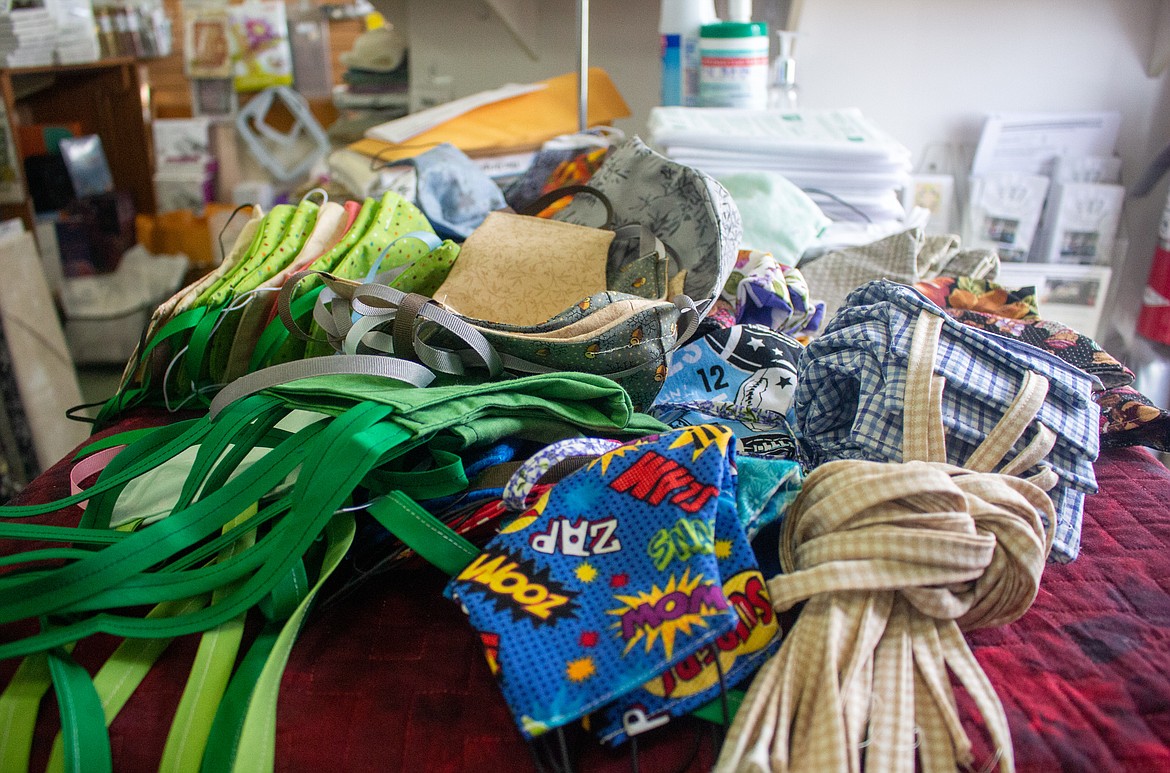 A collection of recently gathered donated masks sit in the front of the Fabric Patch store in Ephrata as Cindi Rang and her employees work to assist with shortages around the community.