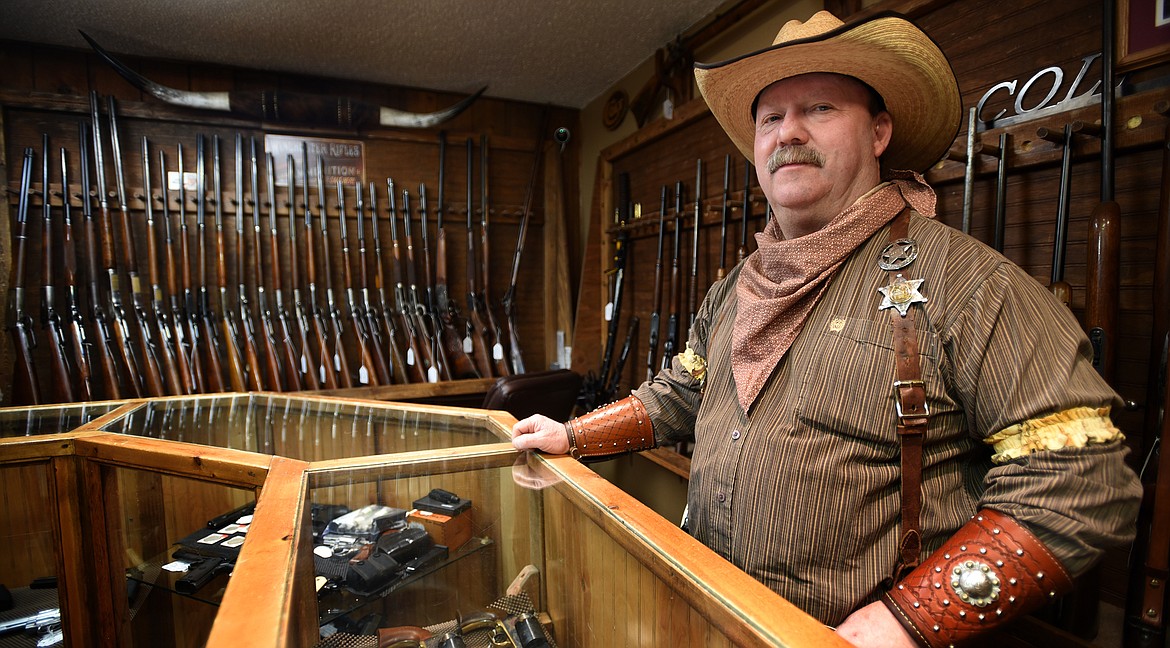 Richard Cheney, owner of Short Colt Antique Firearms in Bigfork, shows off his current inventory. (Jeremy Weber/Bigfork Eagle)