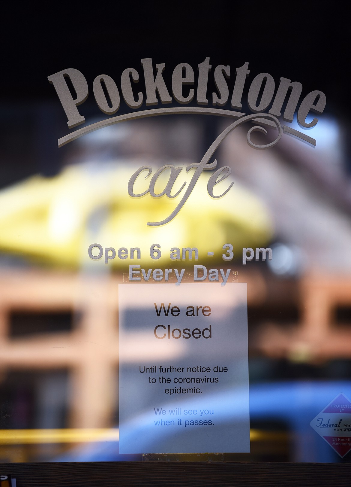 A sign posted on the door of Pocketstone Cafe in Bigfork regarding their operations during the coronavirus pandemic on Wednesday, March 18. (Casey Kreider/Daily Inter Lake)