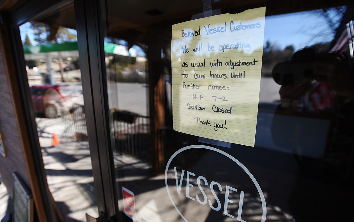 A sign posted on the door of Vessel in Bigfork regarding their operations during the coronavirus pandemic on Wednesday, March 18. (Casey Kreider/Daily Inter Lake)