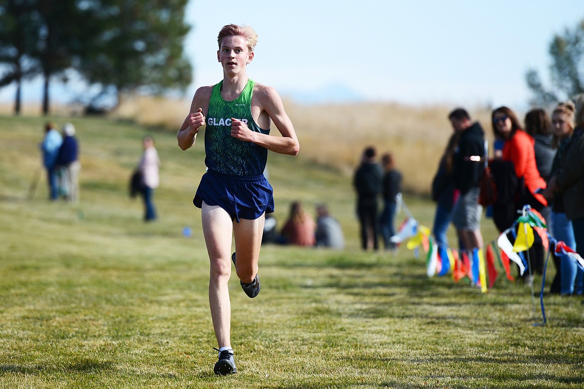 Glacier’s Simon Hill heads down the home stretch at the Glacier Invite at Rebecca Farm on Wednesday, Oct. 16, 2019. Hill placed first in the boys’ race. (Casey Kreider/Daily Inter Lake)