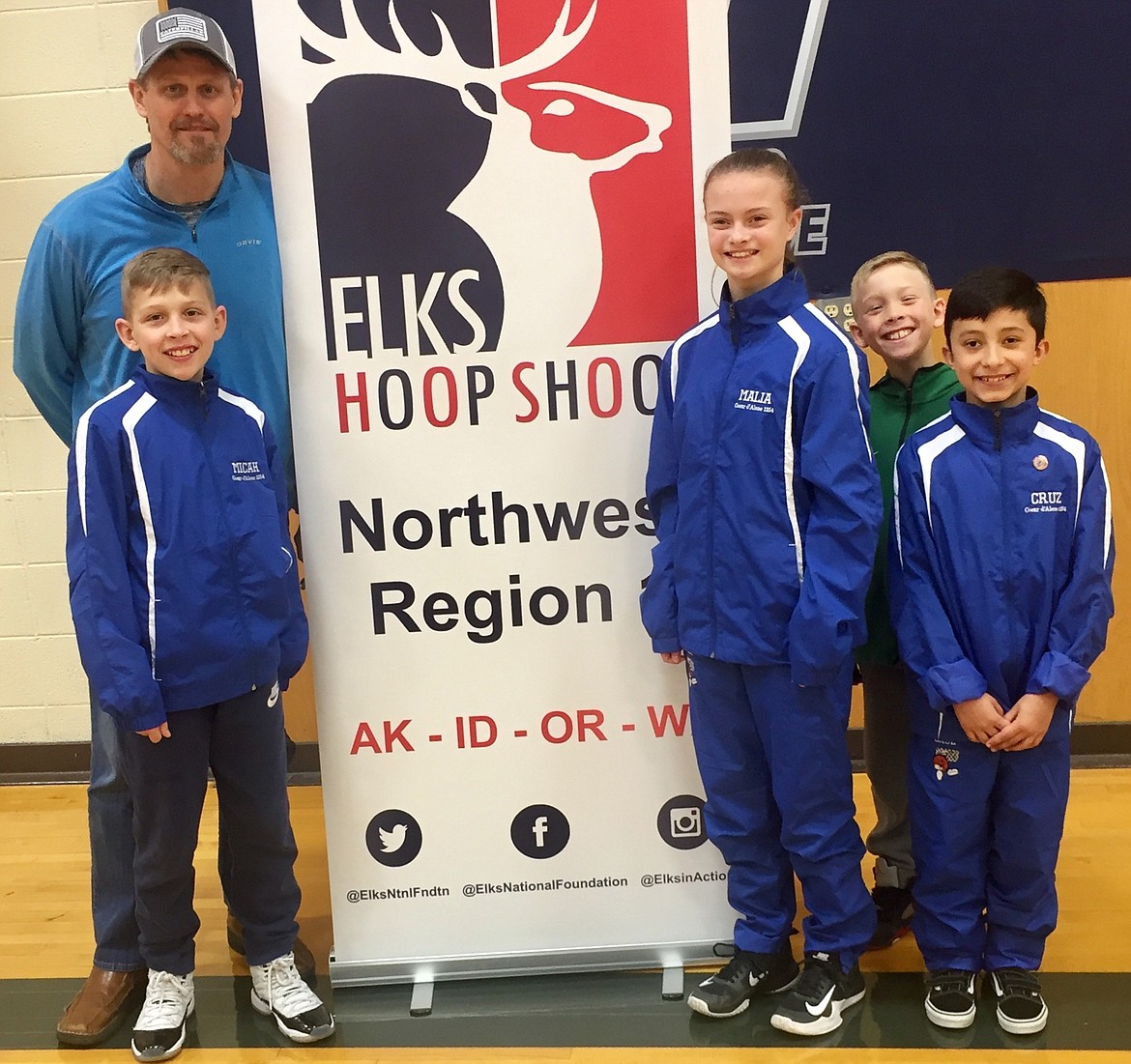 State champions from the Coeur d’Alene Elks Lodge who competed at the regional Elks Hoop Shoot in Pasco, Wash., were, from left, Micah Hodges, Malia Miller and Cruz Andrich. Back left is Todd Stoddard, Coeur d’Alene Elks Hoop Shoot director.