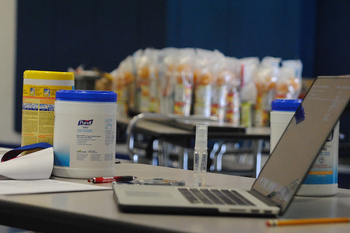 During Superior School pickup day for curriculum and lunches, sanitation is an integral part of keeping the community healthy and safe. (Amy Quinlivan)