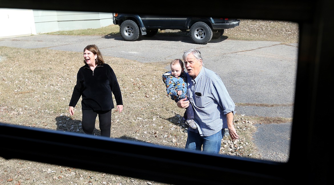 Families of students greet Bus 18 with a smile as it makes one of more than 20 stops along its route.