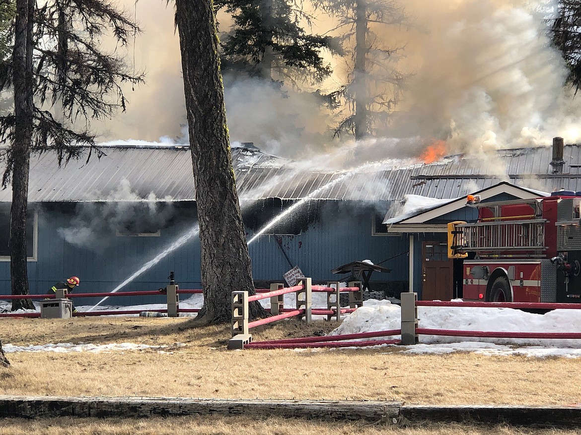 Firefighters of the scene of a blaze at the Point of Rocks Restaurant and Lounge near Olney on Tuesday evening. (Tim Prince photo)