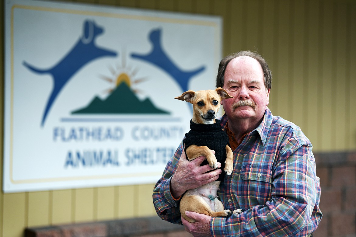Cliff Bennett, director at the Flathead County Animal Shelter, holds Indie, a Chihuahua/dachshund mix outside the facility on Wednesday, March 25. (Casey Kreider/Daily Inter Lake)