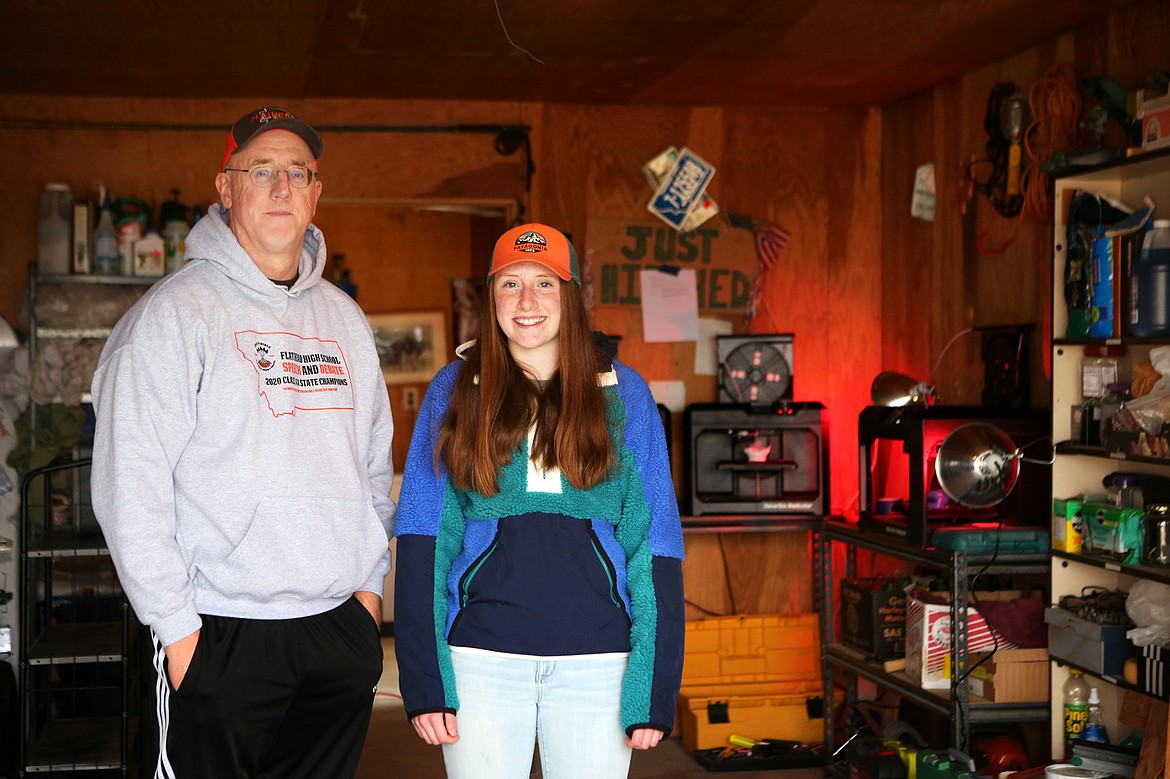 Todd Spangler, a chemistry teacher at Whitefish High School, is pictured with his daughter Leak Spangler, 15. Spangler has been producing masks using 3D printers around the clock with help from his daughter. (Mackenzie Reiss/Daily Inter Lake)