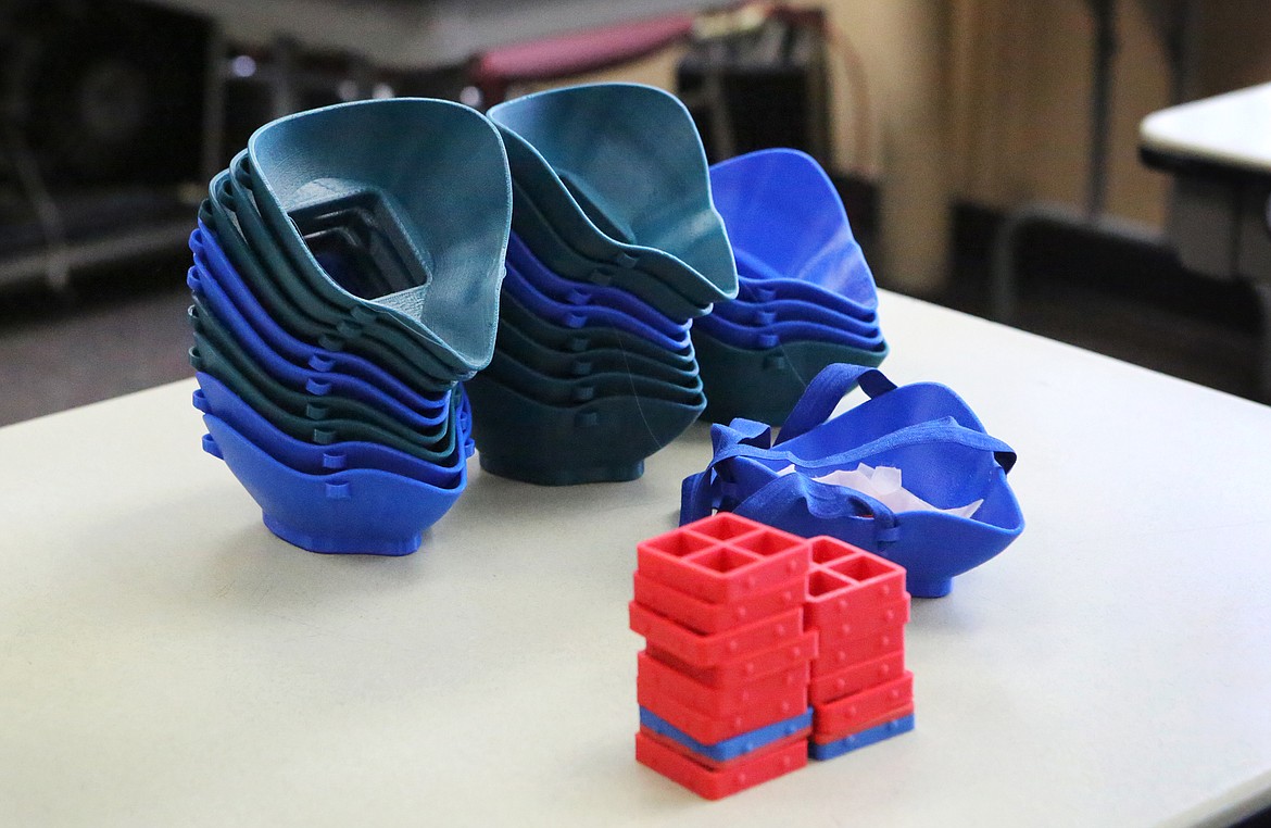 Stacks of 3D printed N95 masks are pictured at Flathead Valley Community College. (Mackenzie Reiss/Daily Inter Lake)