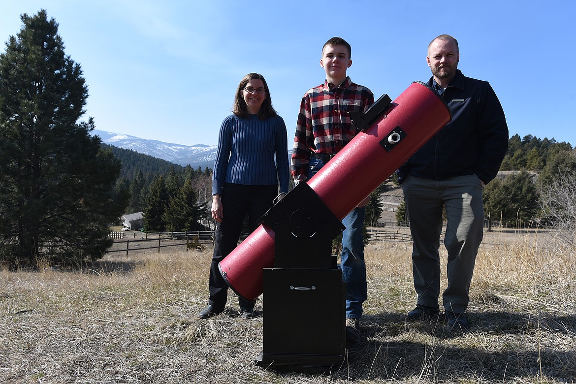 Jennifer and Andrew Hawken, along with Lone Pine State Park Manager Brian Schwartz, stand behind the 8-inch Dobsonian telescope constructed by Andrew which is used by the Flathead Valley Junior Astronomers. (Jeremy Weber/Daily Inter Lake)