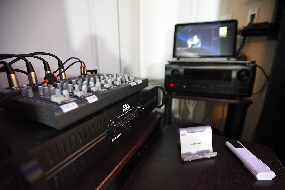 A surround sound system and audio mixer, left, and an image management system used to project images during services at Darlington Cremation and Burial Service on Wednesday, April 1. (Casey Kreider/Daily Inter Lake)