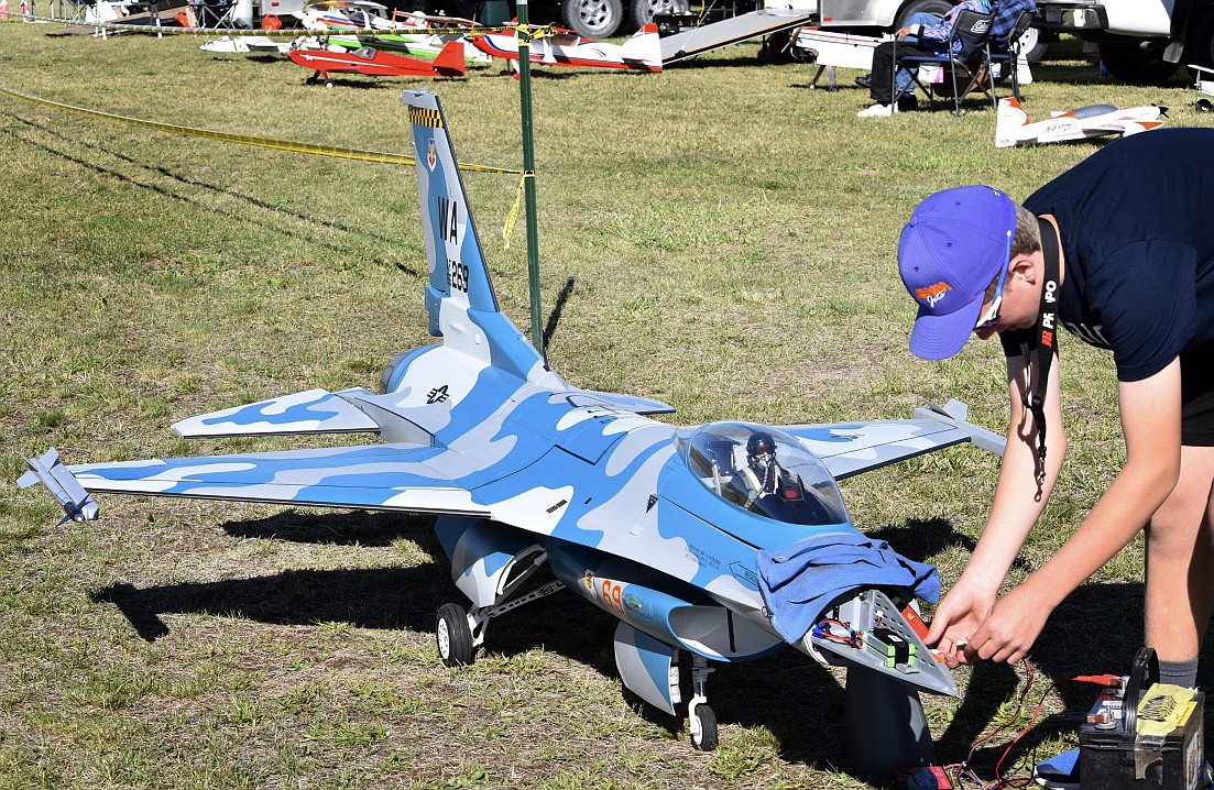 Josh Clark works on one of his F-16 turbine models at a show. (Photo provided)