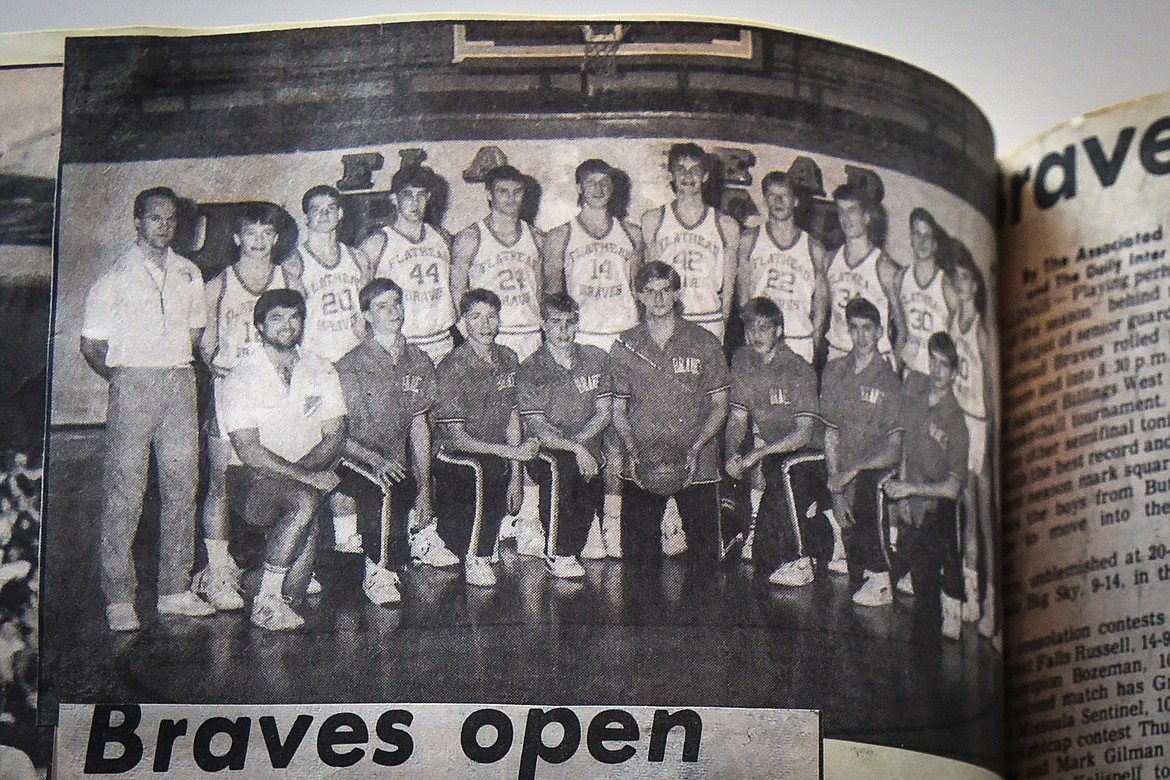 A newspaper clipping in a scrapbook shows a team photo of the 1989 Flathead Braves boys basketball team. (Casey Kreider/Daily Inter Lake)