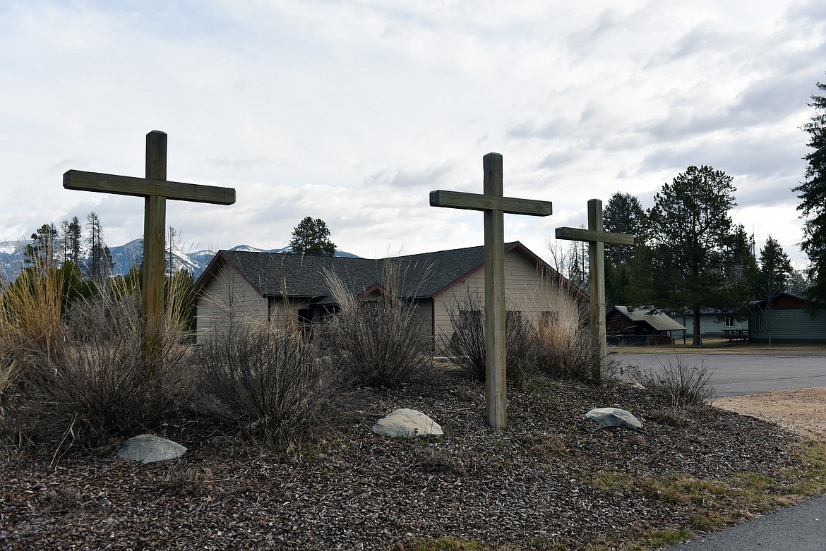 Three crosses stand in front of the True Life Church on Seventh Street West. The church is streaming its Easter Sunday service online. (Heidi Desch/Whitefish Pilot)