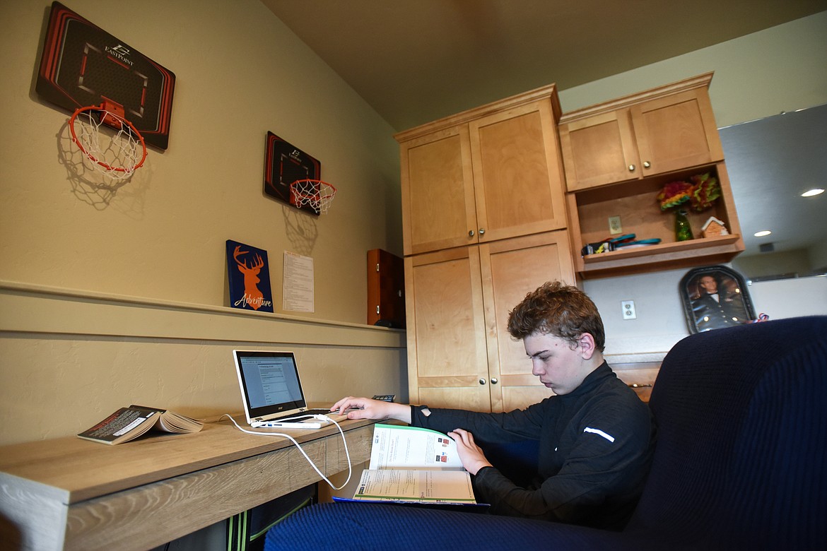 Owen Carpenter studies in his work space in the basement of the residence on Tuesday, April 7. (Casey Kreider/Daily Inter Lake)