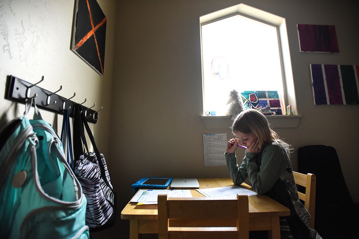 Lola Carpenter studies at her work space in a second-floor hallway on Tuesday, April 7. (Casey Kreider/Daily Inter Lake)