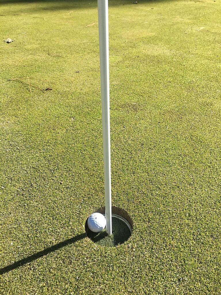 At the Coeur d’Alene Golf Club, employees cut up old driving range mats and slipped them around the flagsticks, meaning the ball doesn’t drop as far in the cup, lessening the chance of players touching the flagstick.