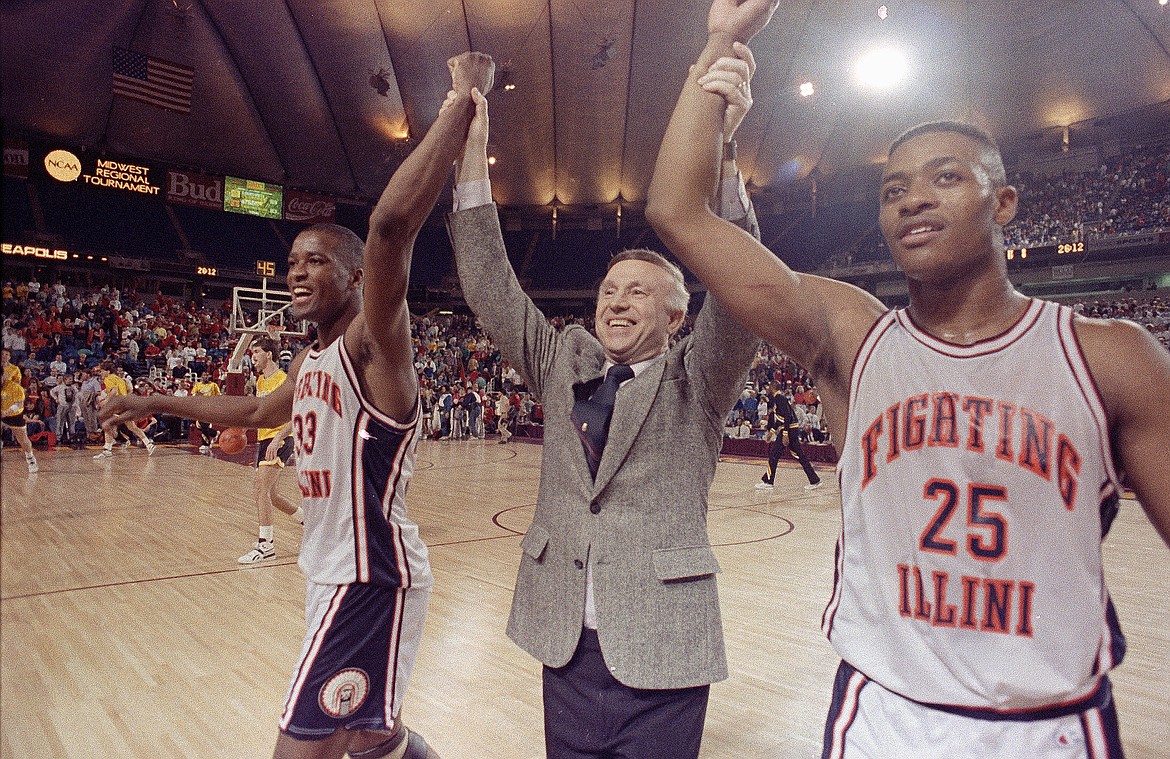 DOUG MILLS/Associated Press 
 Illinois head coach Lou Henson walks from the court hand in hand with players Kenny Battle, left, and Nick Anderson following their victory over Louisville in a 1989 NCAA regional championship game at the Metrodome in Minneapolis.