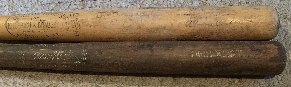 At top, a well-worn Al Kaline-signature Louisville Slugger. Below, a bat which may include the signature of Kaline’s Detroit Tigers teammate, Norm Cash. Or it may not.