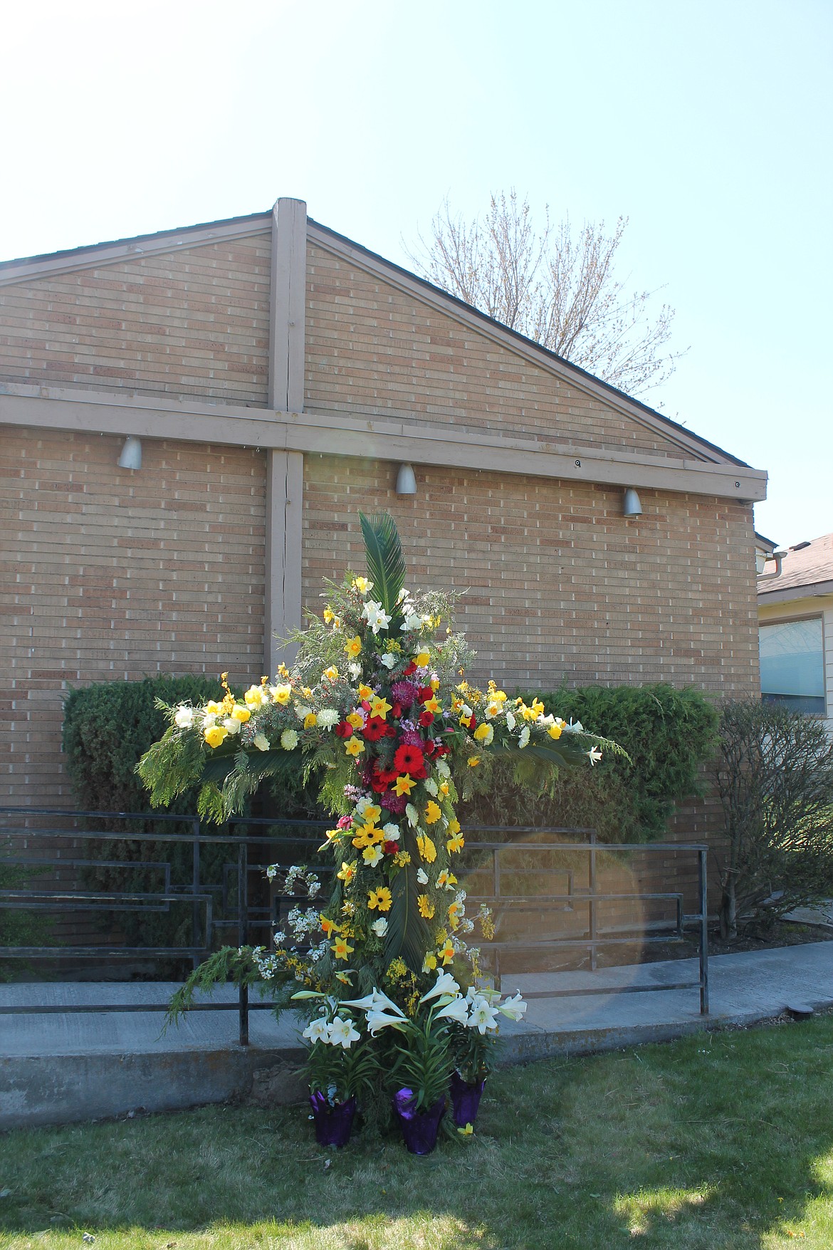 The finished flower cross stands outside Immanuel Lutheran Church on Easter Sunday.