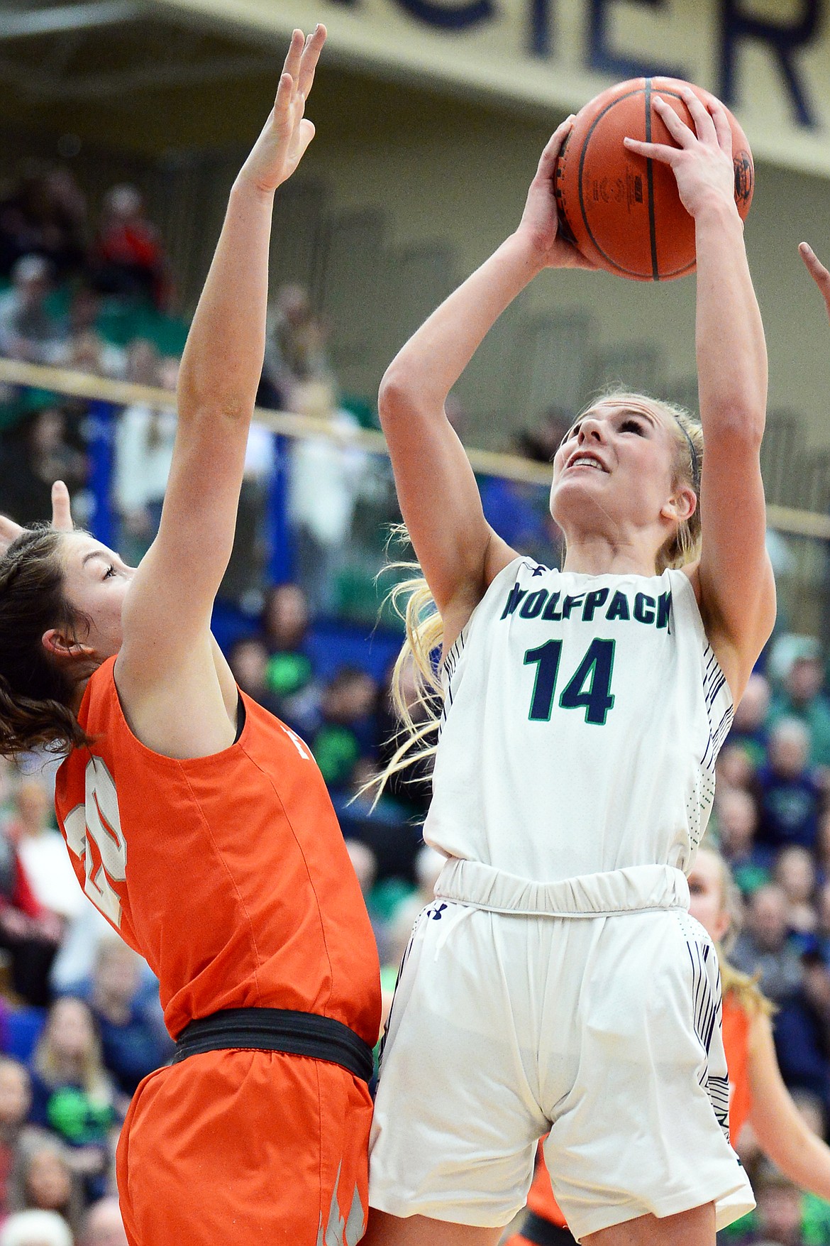 Glacier's Aubrie Rademacher (14) looks to shoot against Flathead's Bridget Crowley (20) during a crosstown matchup at Glacier High School on Friday, Feb. 21. (Casey Kreider/Daily Inter Lake)