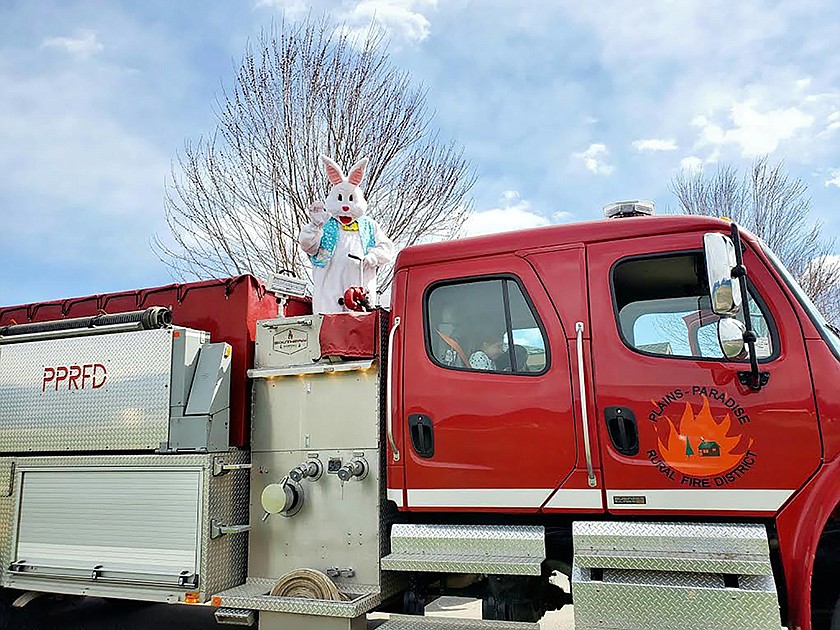 The Easter Bunny, also known as Montana Highway Patrol Trooper Steve Spurr, waves from a Plains-Paradise Rural Fire District tanker truck as they enter the parking lot at Clark Fork Valley Hospital Sunday afternoon in Plains. Spurr, who is also the president of the Plains Lions Club, made a special trip visiting children and older residents at the hospital. Spurr said his wife, Whitney Tanner-Spurr, works at the hospital and had the idea for the fire truck ride since the annual Lions Easter Egg Hunt was cancelled due to COVID-19. (Photo courtesy Whitney Tanner-Spurr)