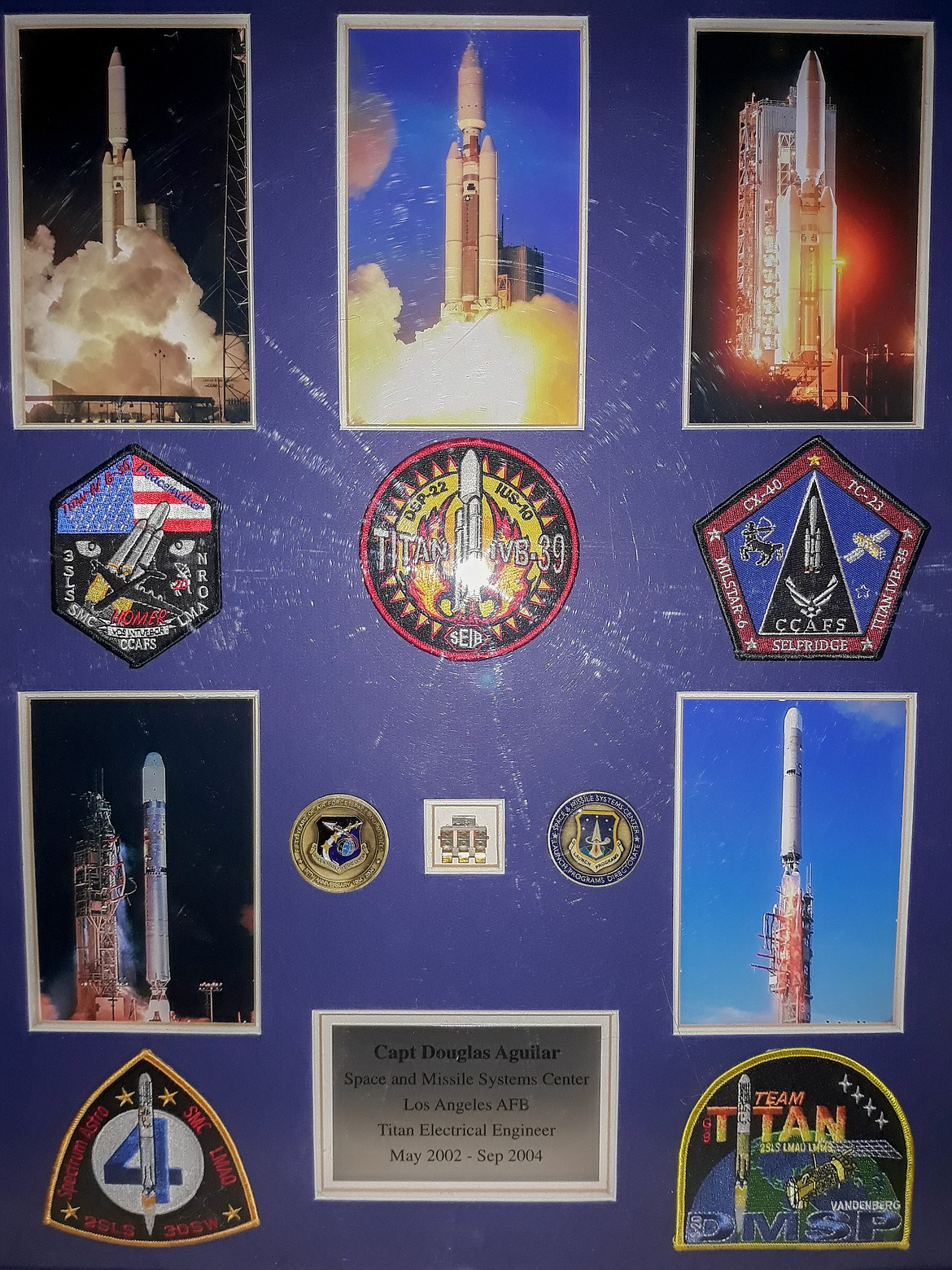 Courtesy photo
A commemorative plaque containing pictures and patches from launches Douglas Aguilar was a part of with the Titan launch program in the early 2000s.