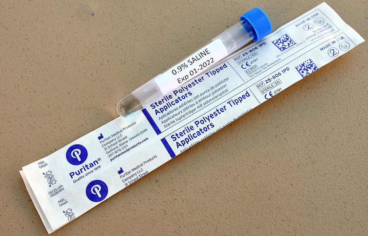 A nasal swab and vial used for coronavirus testing. (Duncan Adams/The Western News)