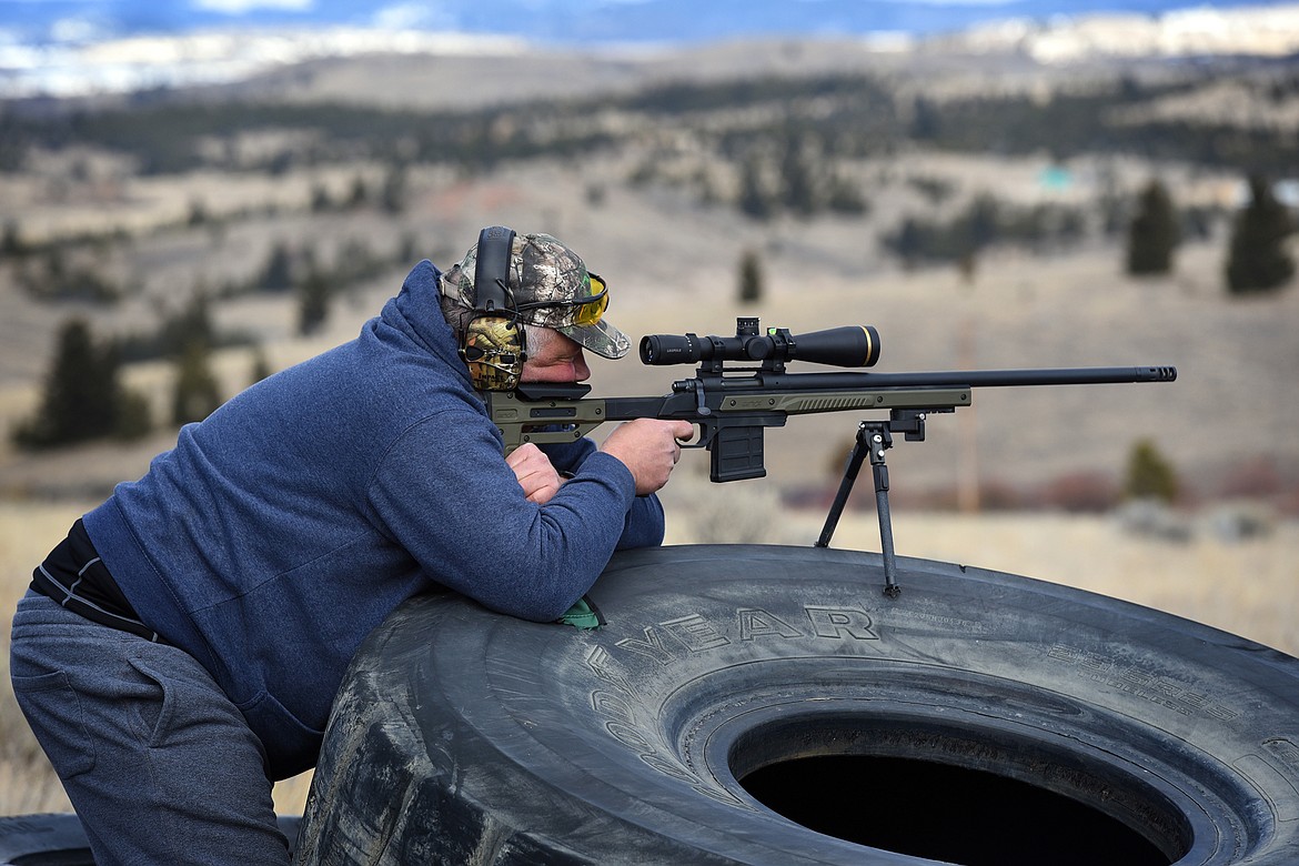 Shooter Joe Bauer takes aim during the monster tire stage at the Butte Gun Club last month. (Jeremy Weber/Daily Inter Lake)