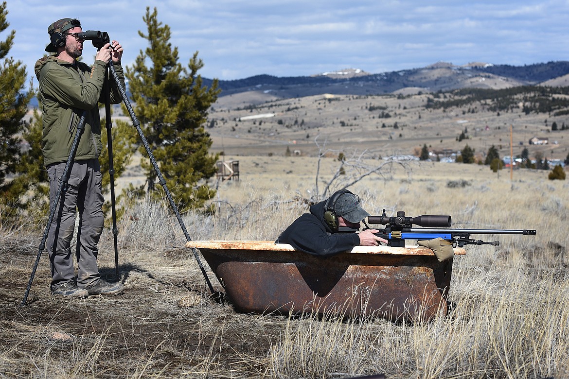 Whitefish’s Corey Harris shoots the bathtub stage in Butte while Jared Miller spots for him.
