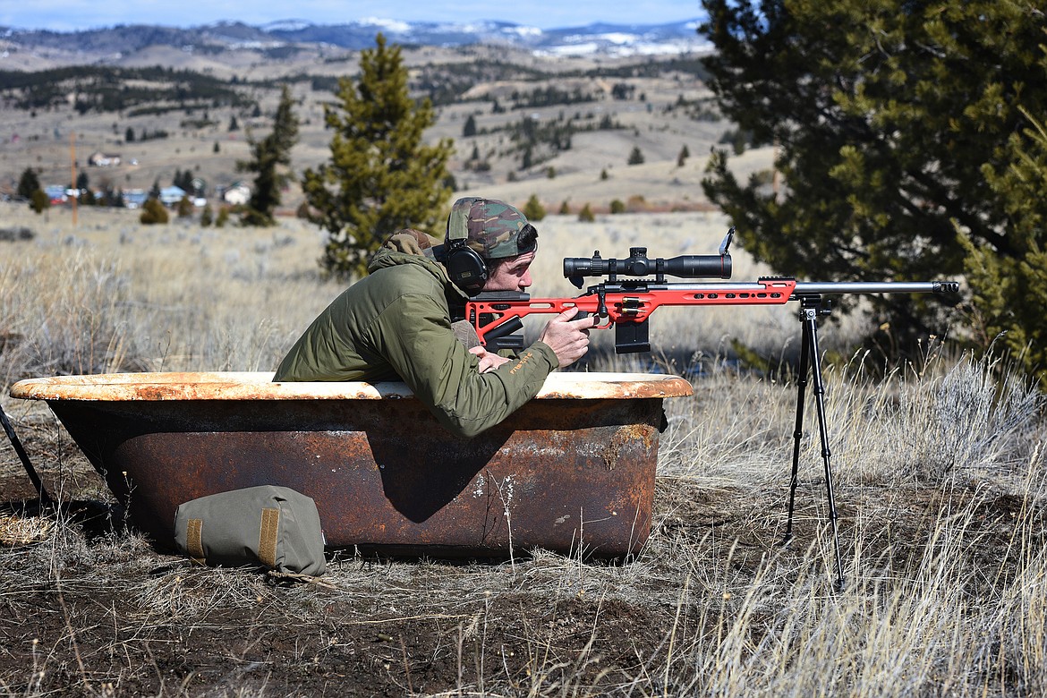 Bozeman’s Jared Miller takes aim during the bathtub stage of the Butte Gun Club PRS style match last month. (Jeremy Weber/Daily Inter Lake)