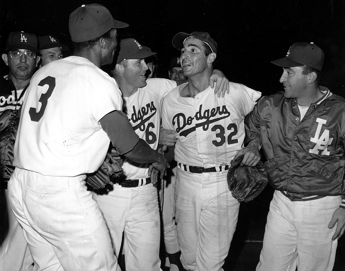 Sandy Koufax (32) of the Los Angeles Dodgers after throwing a perfect game against the Chicago Cubs on Sept. 9, 1965.