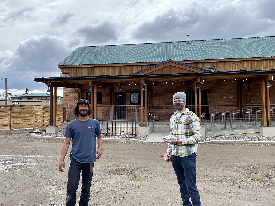 Nic Headlee, right, a project manager at ZaneRay, picks up a meal from Sunrift Restaurant in Kalispell during the company’s weekly lunch on Wednesday, April 15. (Courtesy photo).