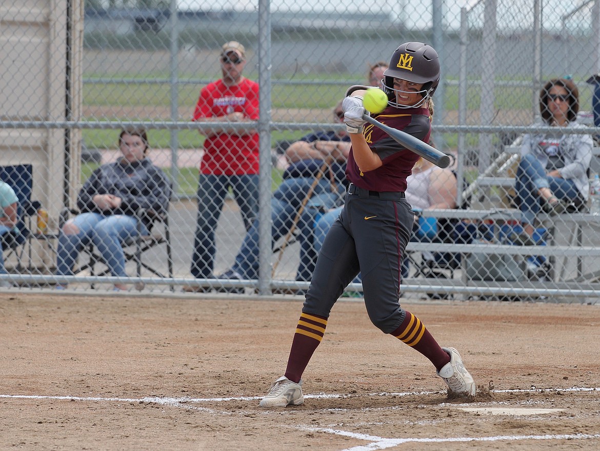 Gina Skinner watches in the ball as she sends out a shot for the Chiefs last spring as a junior.