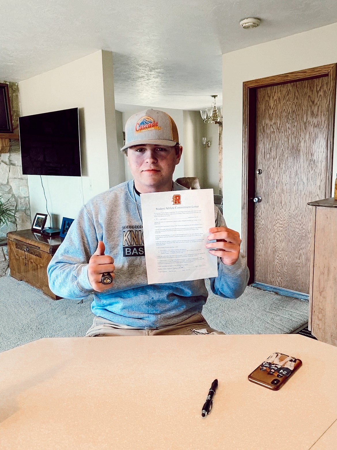 Royal High School senior J.C. Worsham gives the thumbs up after signing his commitment to play baseball at College of the Redwoods next season.