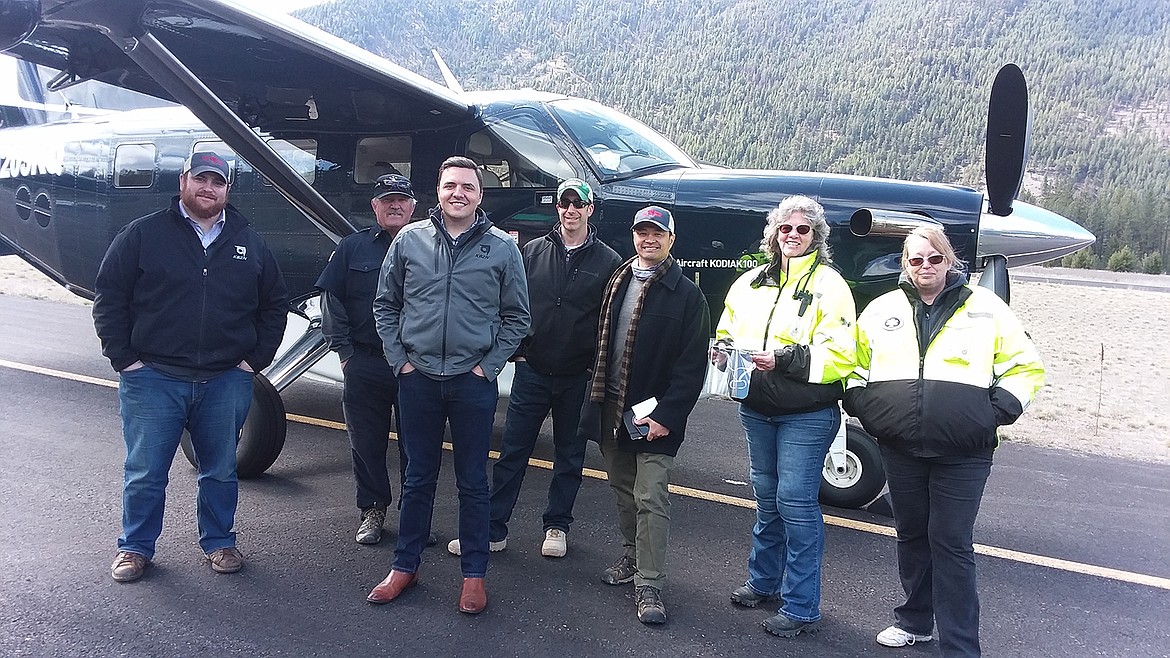 Barrett Farrell, Chief Bridger Aerospace Pilot; Steve Temple, Mineral County Airport Manager and Chief of the Superior Volunteer Fire Department; Ben Keeley, Engineering Manager; Ben Little, Logistics; K Mita, Director of Marketing and Communications; Donna Richter and Julye Miller, West End EMTs and Volunteer Fire Department members stopped for a photo last week after Bridger made the trip to Superior to donate 250 facemasks for first responders in the county. (Monte Turner/Mineral Independent)