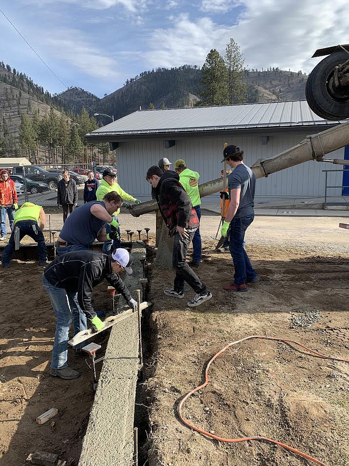 Volunteers prepare to pour concrete in the footers for the new jump pits at Superior School.
(Courtesy photo)
