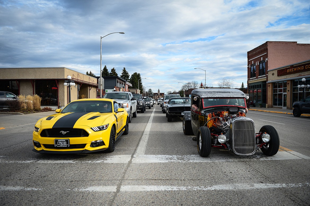 Vehicles stop at a traffic light on Main Street during the Kruise Kalispell event on Friday, April 17. (Casey Kreider/Daily Inter Lake)