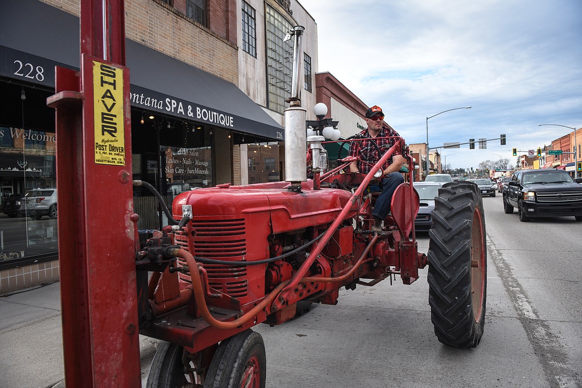 Tim Viano drove his 1947 Farmall International tractor from West Valley to participate in the Kruise Kalispell event on Main Street on Friday, April 17. (Casey Kreider/Daily Inter Lake)