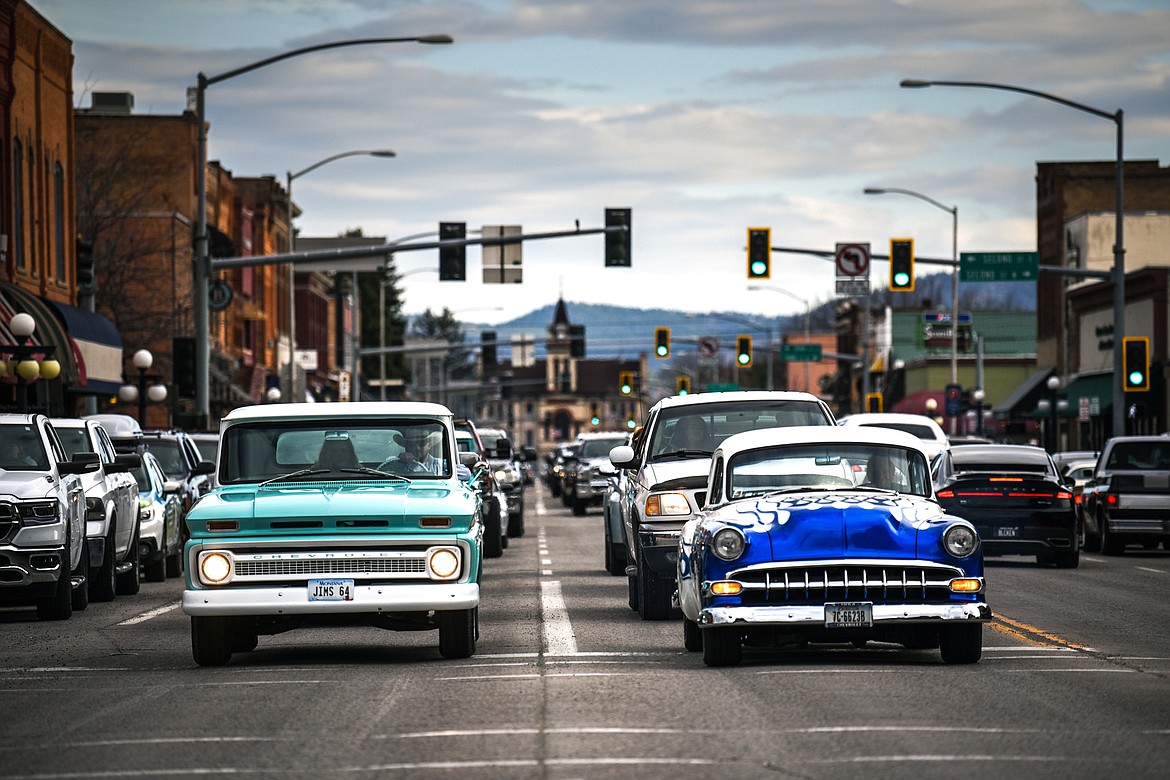 Vehicles stop at a traffic light on Main Street during the Kruise Kalispell event on Friday, April 17. (Casey Kreider/Daily Inter Lake)