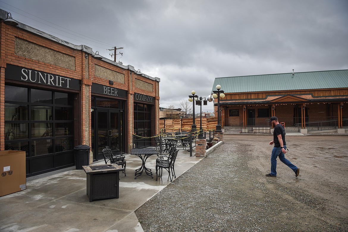 SunRift Beer Company bartender and brewer Kevin Mincheff walks between the brewery and taproom, at left, and the restaurant, right.