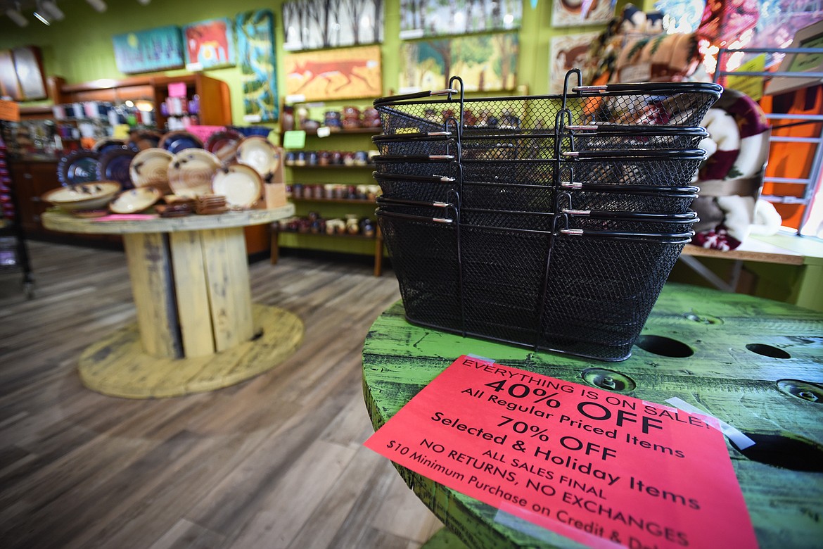 Signs for a going-out-of-business sale are shown at Flair Gifts & Cards in downtown Kalispell on Tuesday, April 28. (Casey Kreider/Daily Inter Lake)