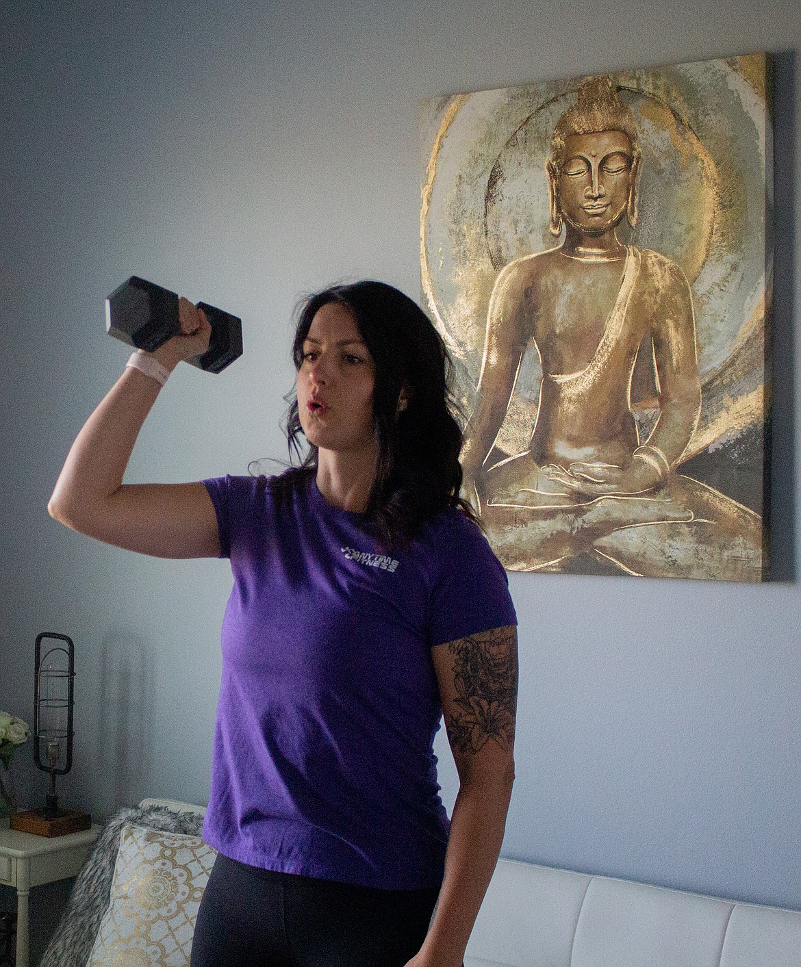 Casey McCarthy/The Sun Tribune Anytime Fitness personal trainer Jitka Garza goes through a workout in her home in Moses Lake during a virtual training session on Monday morning.